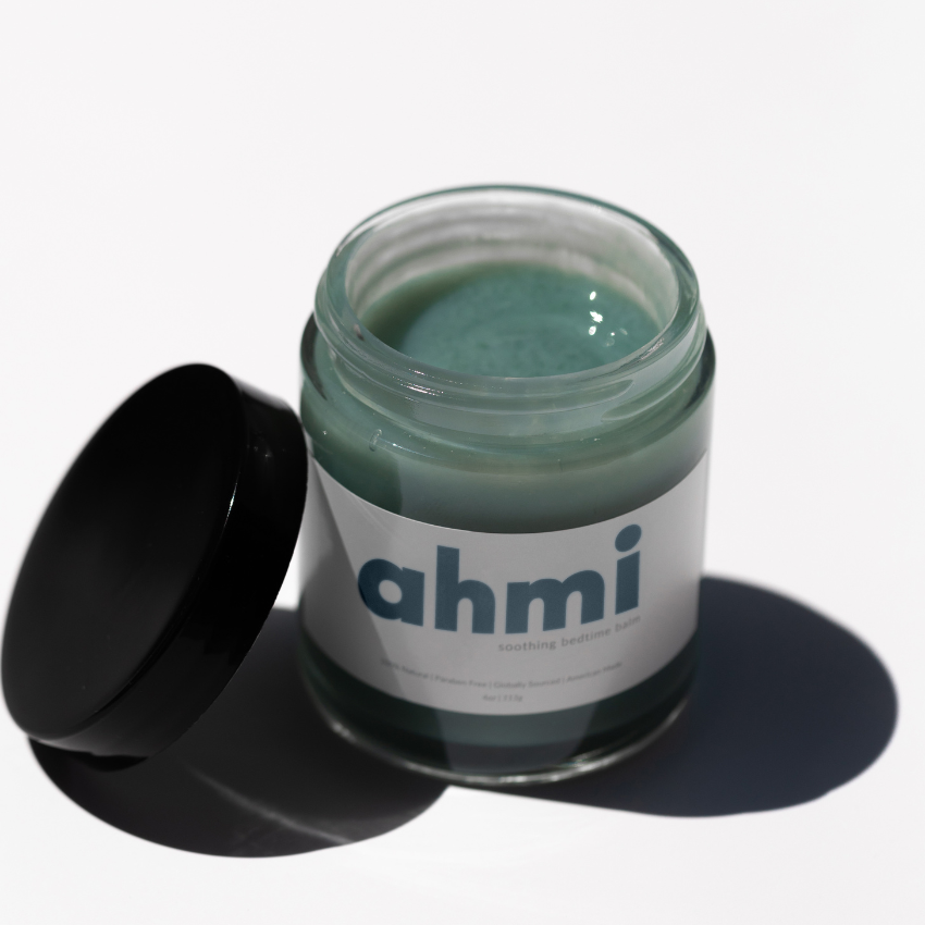 Jar of ahmi soothing bedtime balm with black lid on a white background