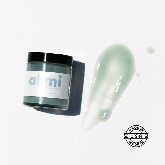 Jar of Ahmi with a swatch on a white background